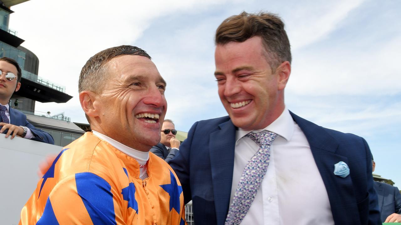 Jamie Richards with stable jockey Opie Bosson after Te Akau Shark won the 2020 Chipping Nortion Stakes at Randwick. Photo: AAP Image/Simon Bullard