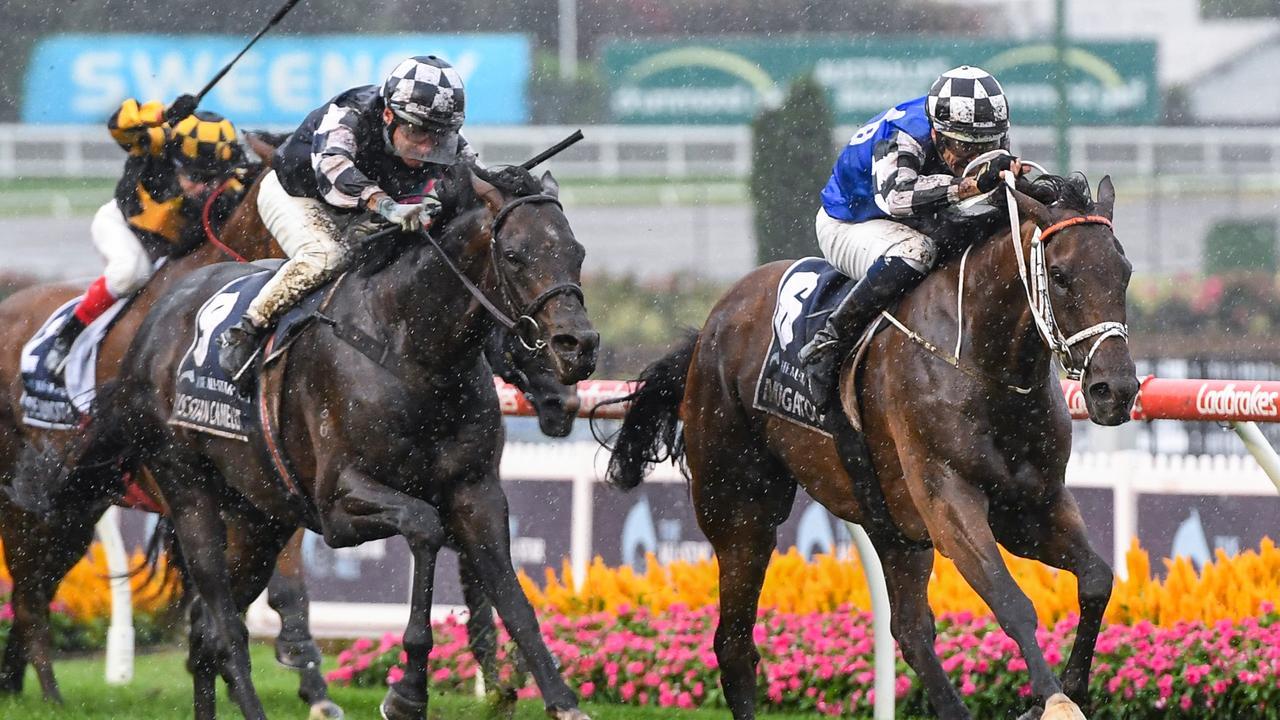 Mugatoo and Hugh Bowman get the inside run to take out the All-Star Mile ahead of Russian Camelot and Damien Oliver. Picture: Racing Photos via Getty Images