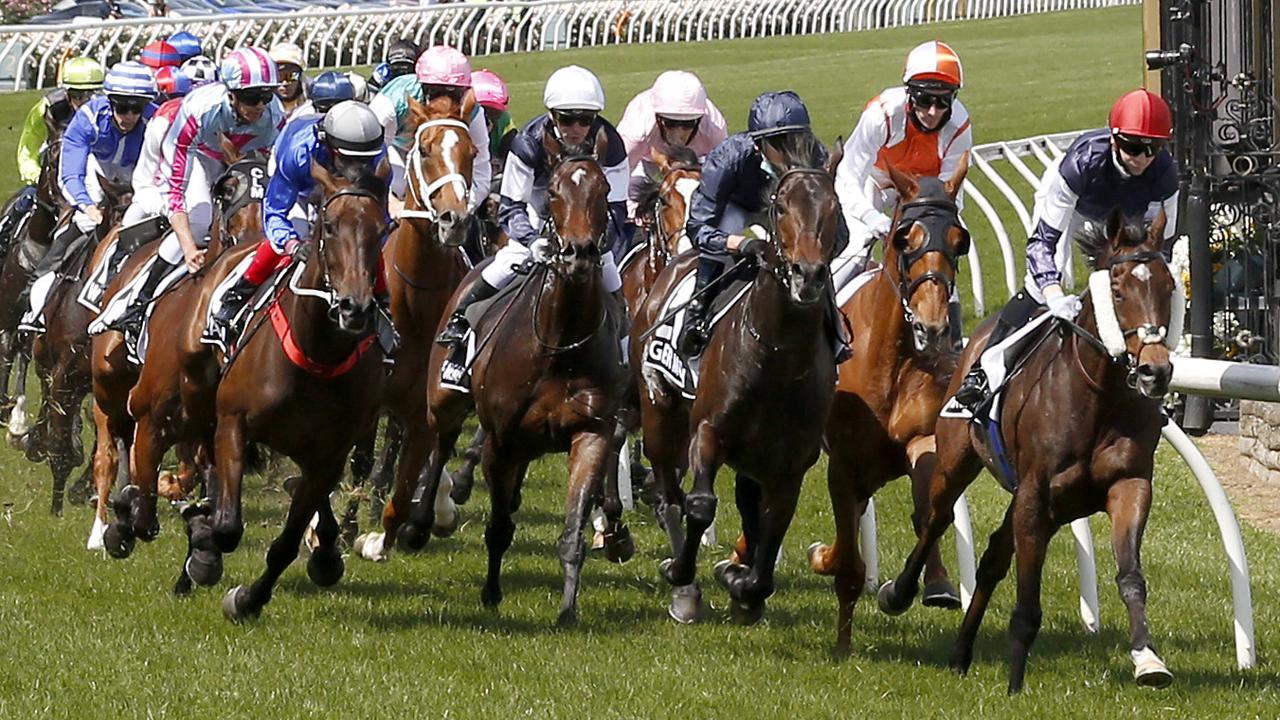 Jye McNeil aboard Twilight Payment leads the field out of the straight the first time in the Lexus Melbourne Cup on Tuesday. Photo: Darrian Traynor/Getty Images.