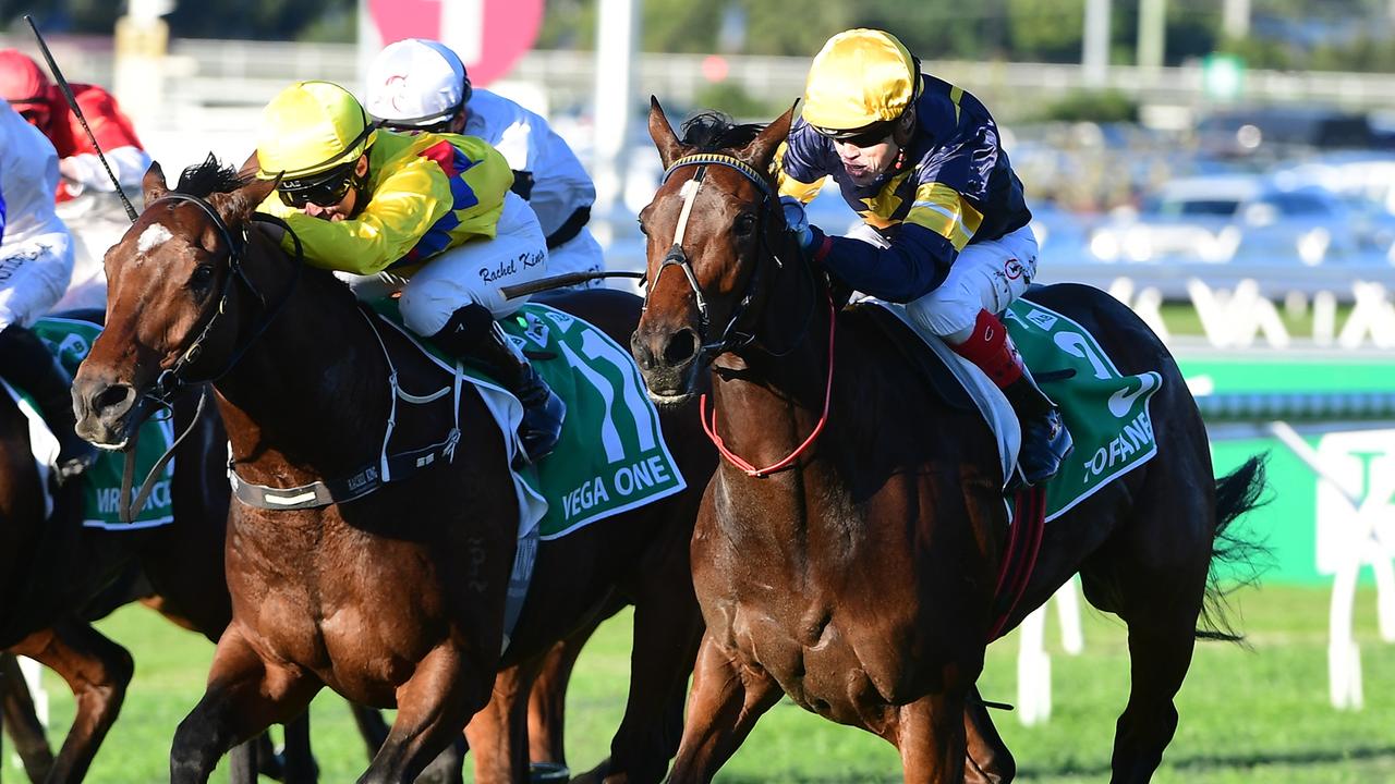 Tofane (Craig Williams) beats Vega One (Rachel King) in a tight finish in the Stradbroke Handicap at Eagle Farm. Picture: Trackside Photography