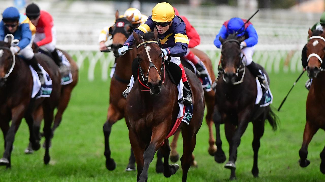 Craig Williams expertly uses his whip to guide Tofane to the outside of the track to win the Tattersall’s Tiara. Picture: Grant Peters–Trackside Photography.