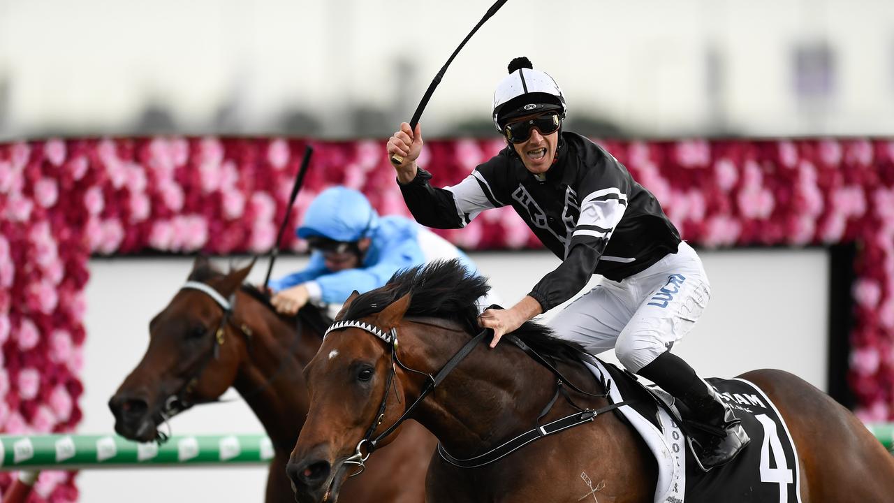 Jockey Ben Looker celebrates after riding Victorem to victory at Eagle Farm. Picture: AAP Image–Albert Perez