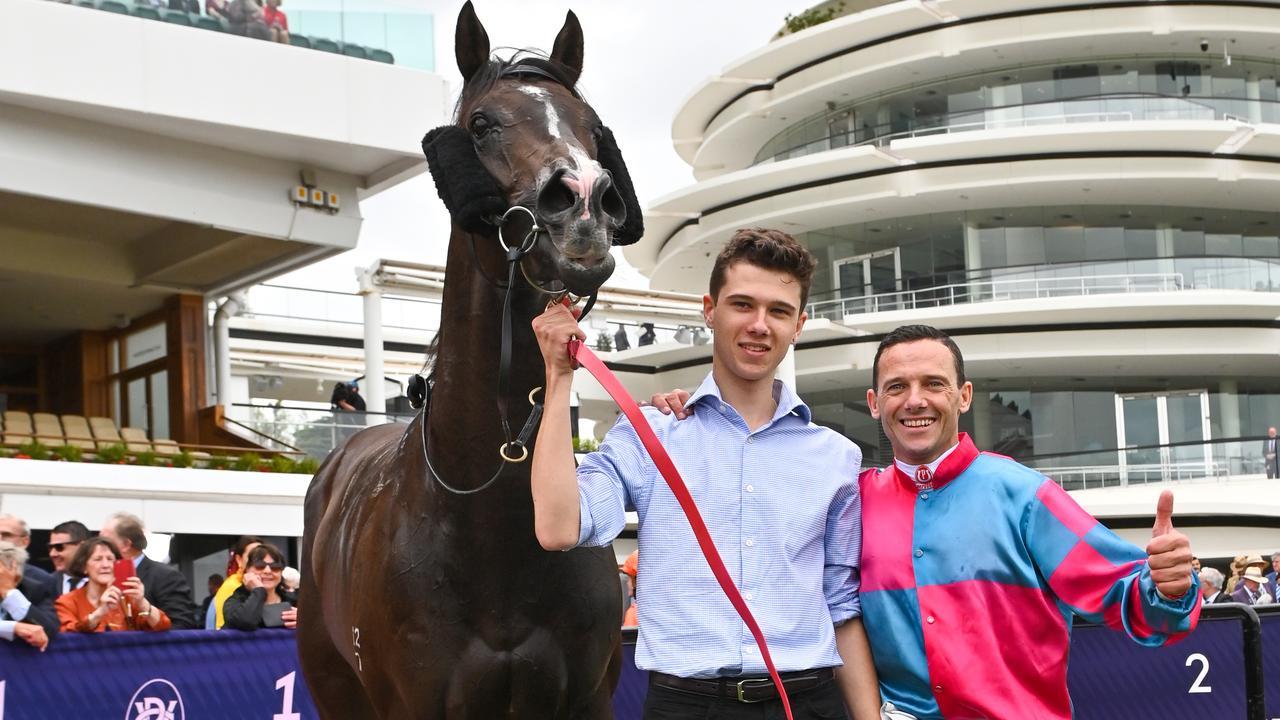 Brett Prebble poses with son Thomas when the youngster strapped Lunar Fox for the VRC Sires’ Produce. Photo: AAP/Vince Caligiuri