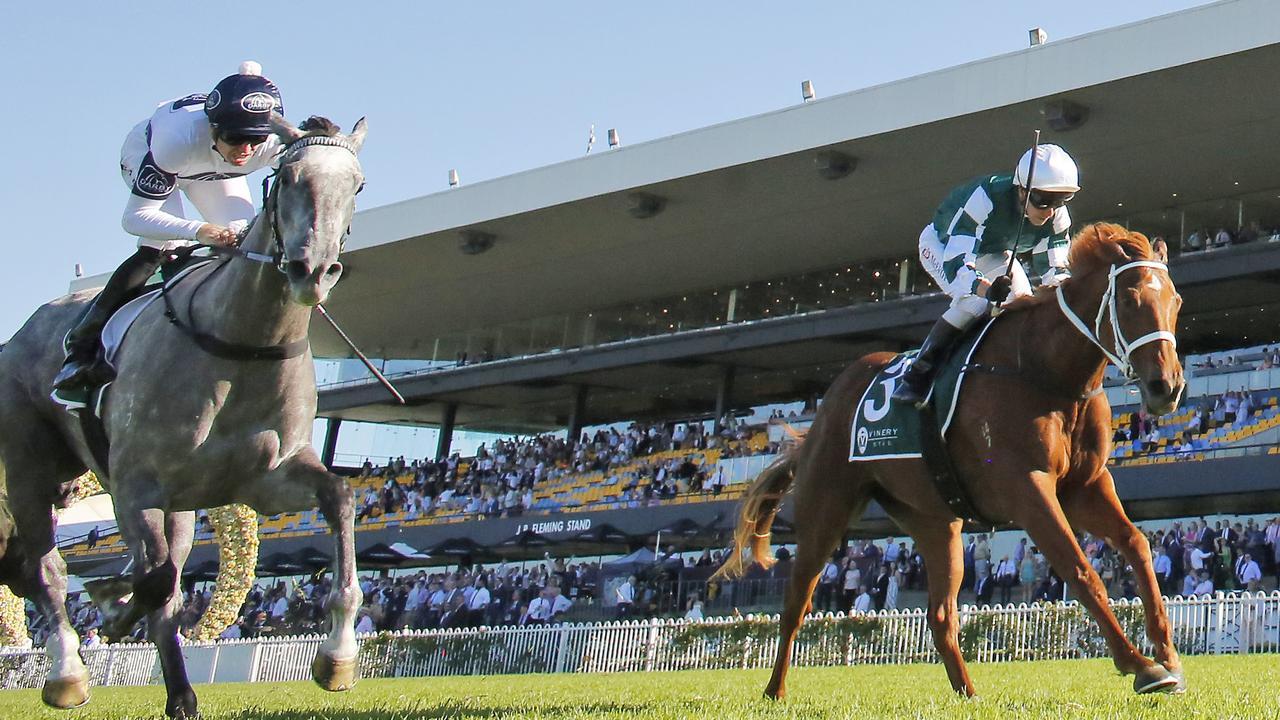 Hungry Heart (green/white silks) chases down favourite Harmony Rose in the Vinery Stud Stakes. Picture: Getty Images