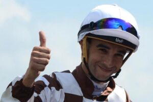 Joao Moreira is thumbs up for his chase on Zac Purton.