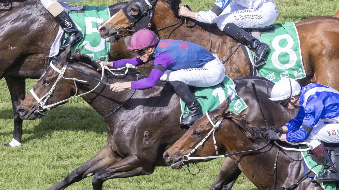 Ahead Start, ridden by James McDonald (pink cap), wins the Highway race at Randwick. Picture: Getty Images