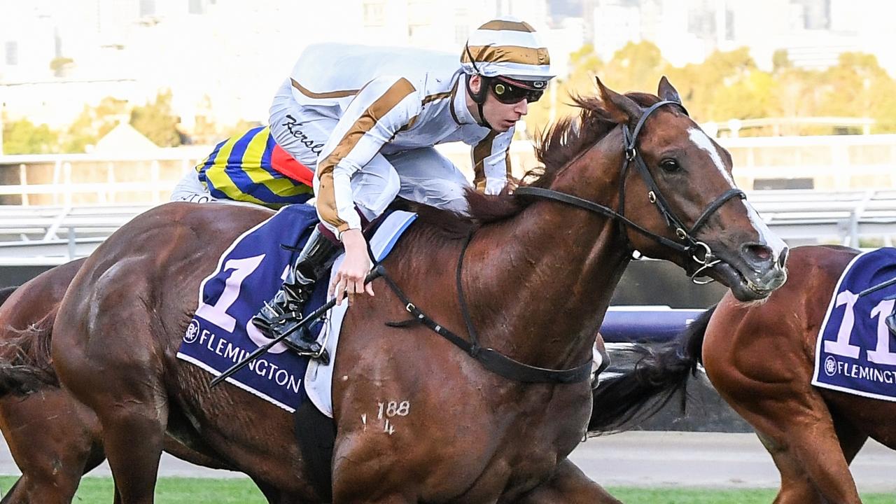 Dice Roll surging to victory at Flemington under jockey Fred Kersley. Picture: Racing Photos