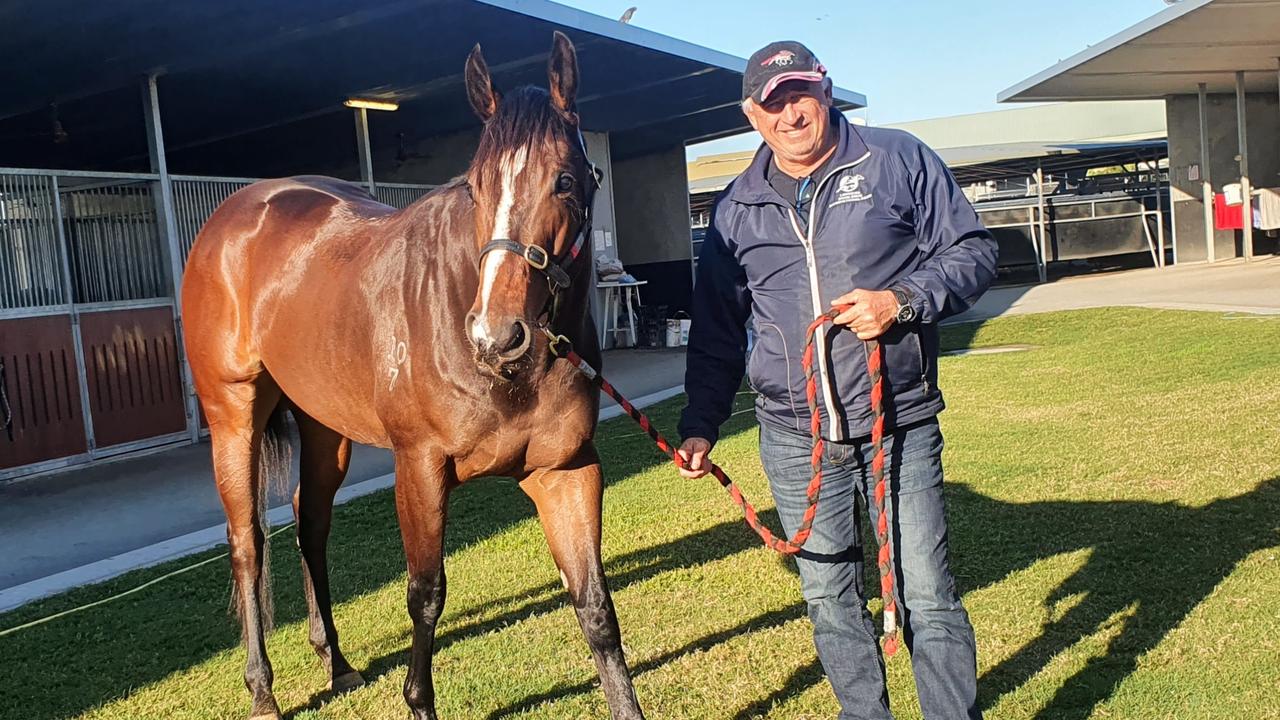 Trainer Rob Heathcote and his star galloper Rothfire after a full-throttle gallop at Eagle Farm on Tuesday morning. Picture: Rob Heathcote