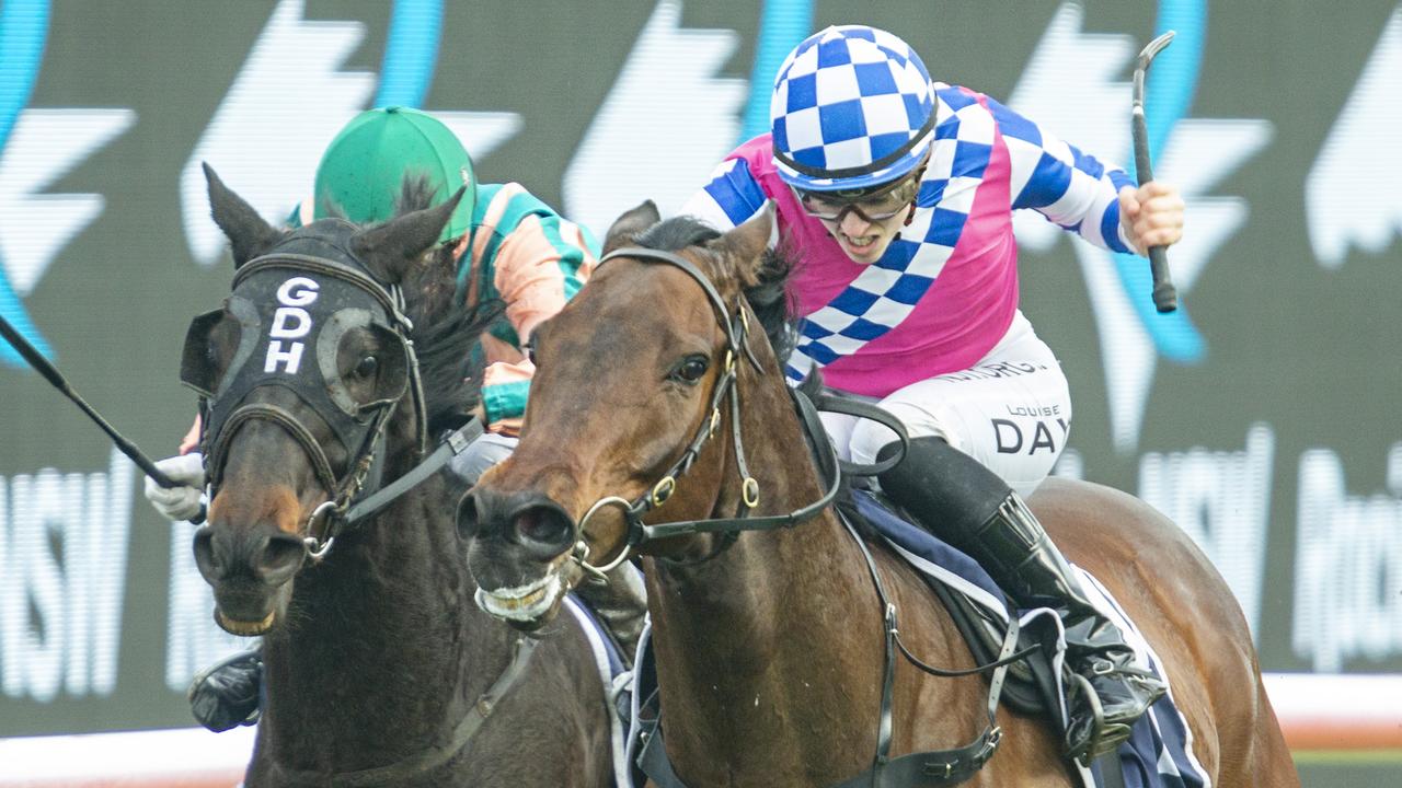 Louise Day (pink) on Man Of Peace at Royal Randwick. Photo: Jenny Evans/Getty Images