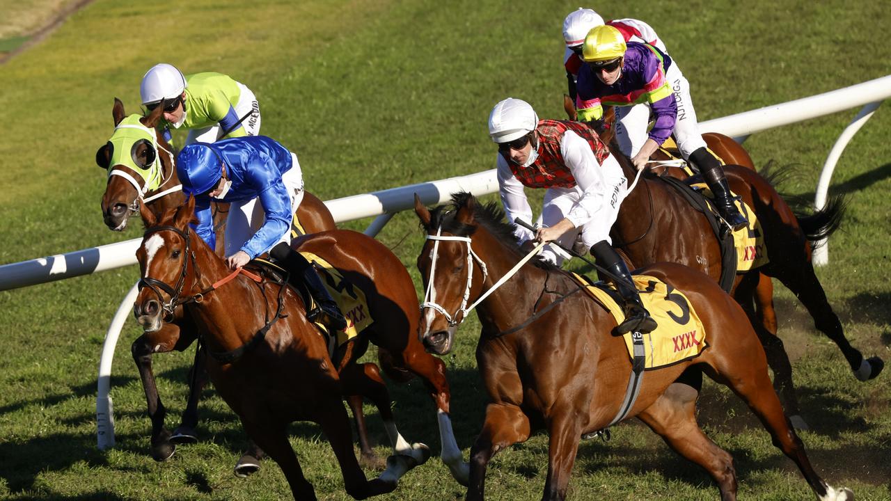 Hugh Bowman on Order Again (white/tartan) get over the top of Ziegfeld to win the XXXX Winter Challenge at Rosehill Gardens. Picture: Photo by Mark Evans–Getty Images