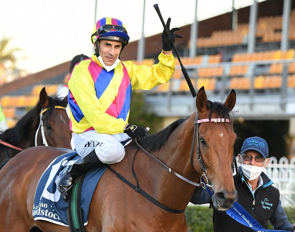 Jeff Penza returns to scale aboard ashman after winning the Cameron Handicap at Newcastle on Friday. Photo: Steve Hart.