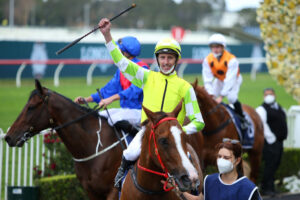 Nash Rawiller celebrates winning the Classique Legend Stakes aboard Eduardo. Photo: Jason McCawley/Getty Images.