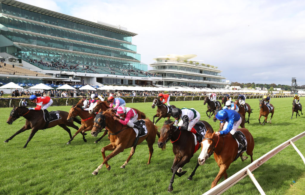 Superstorm (cerise and white) prevails in a blanket finish to the Cantala Stakes. Photo: Robert Cianflone/Getty Images.