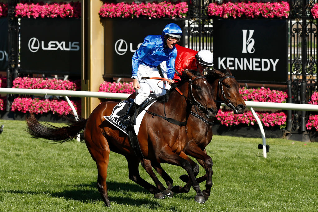 Damien Oliver celebrates winning the VRC Oaks aboard Willowy at Flemington on Thursday. Photo: Darrian Traynor/Getty Images.