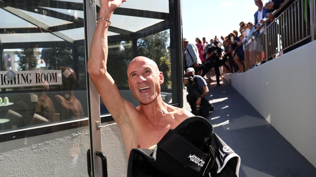 A bare-chested Glen Boss acknowledges the Caulfield crowd after his final race in the saddle. Picture: Michael Klein