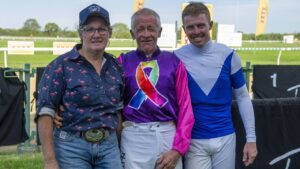 Ross Tilley (centre) with his partner and trainer Carmel Baker (left) and son Les ‘Bubba’ Tilley (right). Pic - Paul McInally.